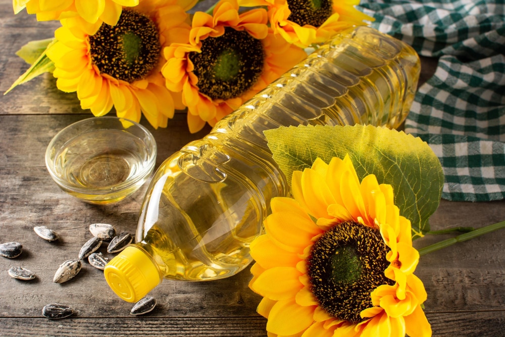 sunflower oil plastic bottle wooden table